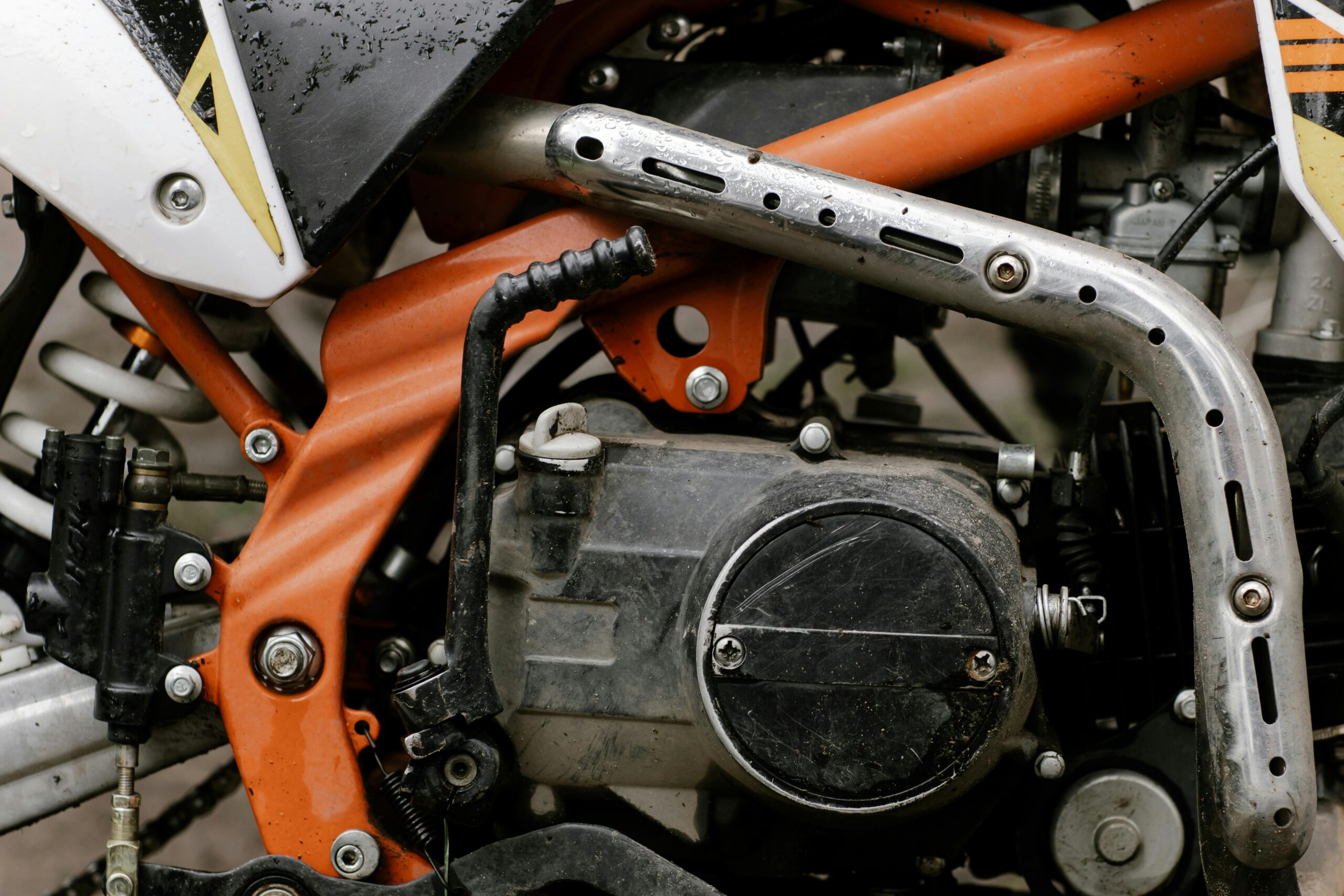 Detailed close-up of motorcycle engine showcasing mechanical components and craftsmanship.